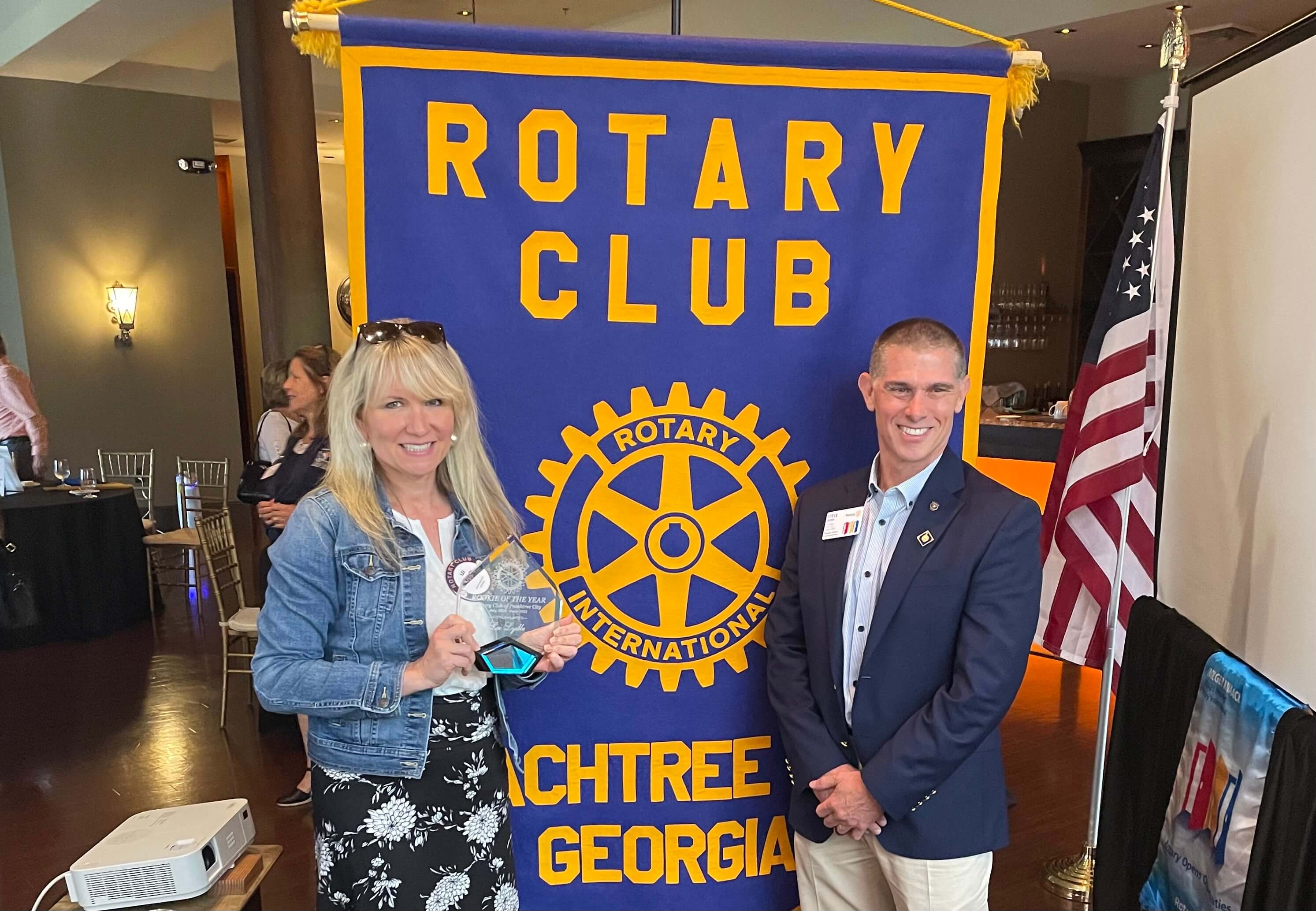 Lei Lydle accepting the Rotary Rookie of the Year award in 2021 from Rotary President, Steve Ivory.