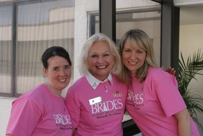 Lei Lydle serving as Chairman of the Brides Against Breast Cancer Wedding Gown Sale in Atlanta in 2006 with two of the fabulous volunteers.